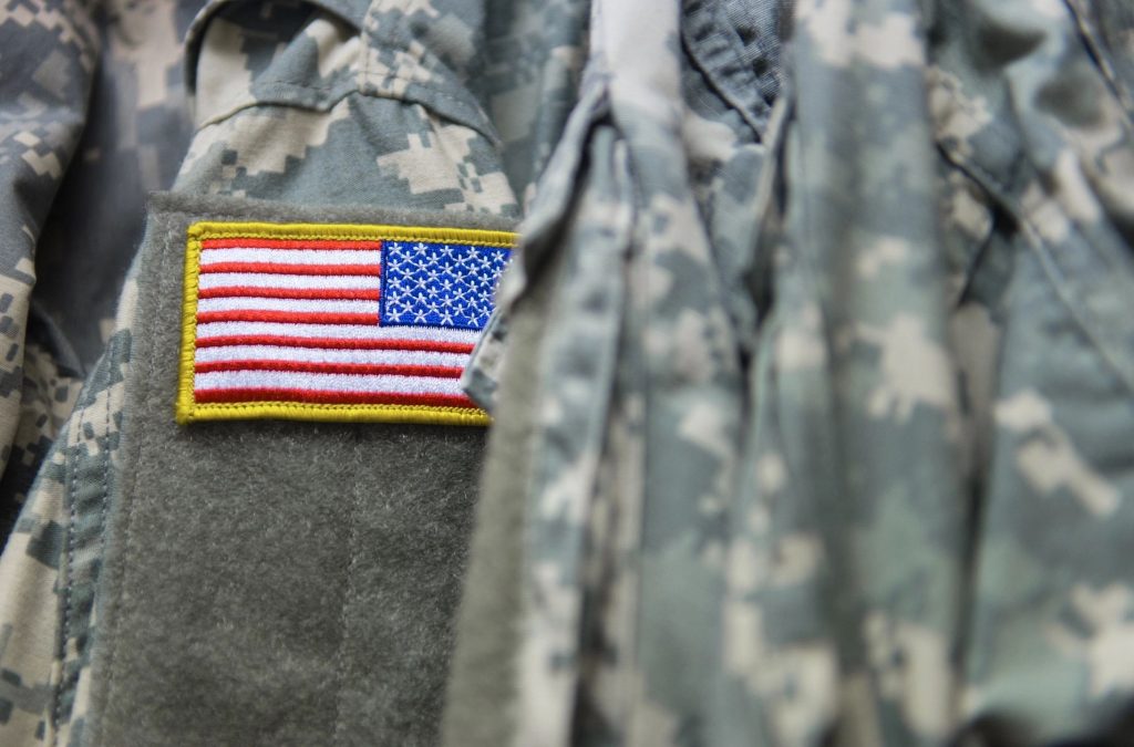 Close-up of an American Flag patch on military fatigues