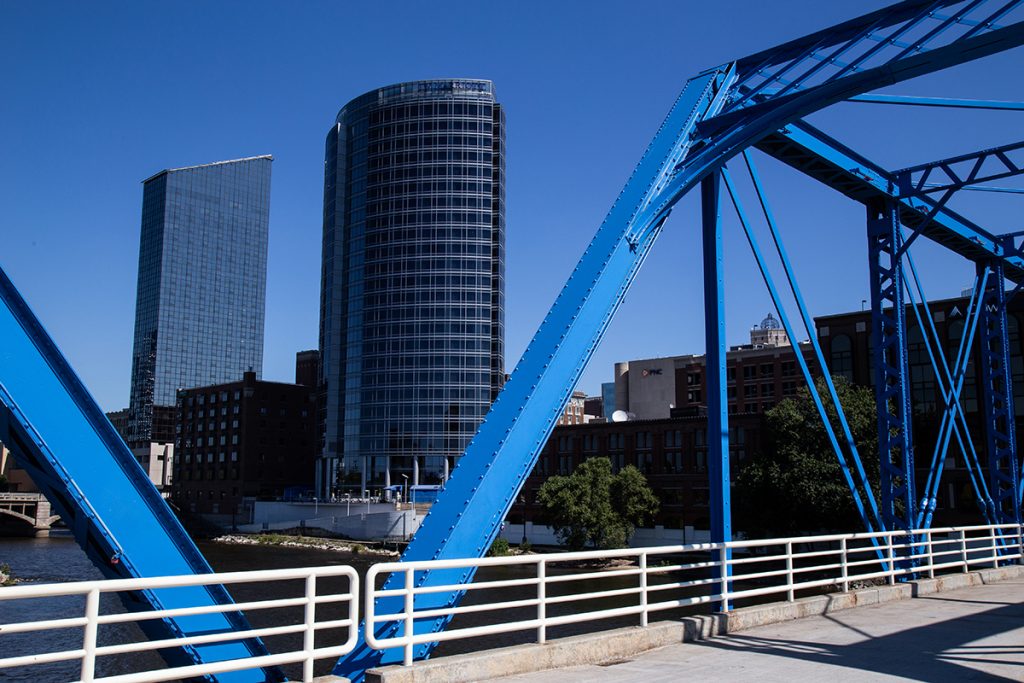 A view of a city from a bridge with blue structures on it