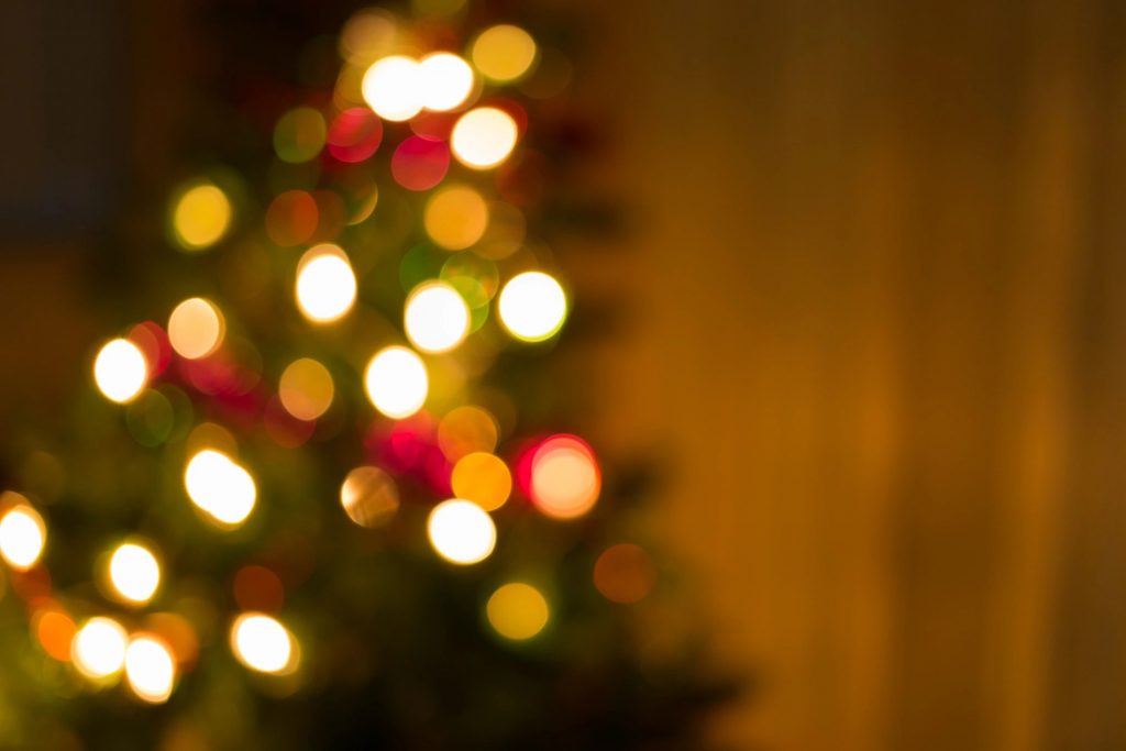 An out-of-focused photo of lights on a Christmas tree