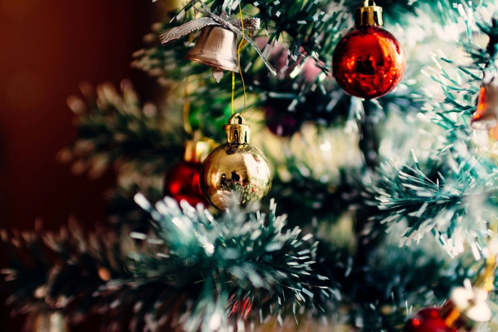 A close-up of bulbs on a Christmas tree