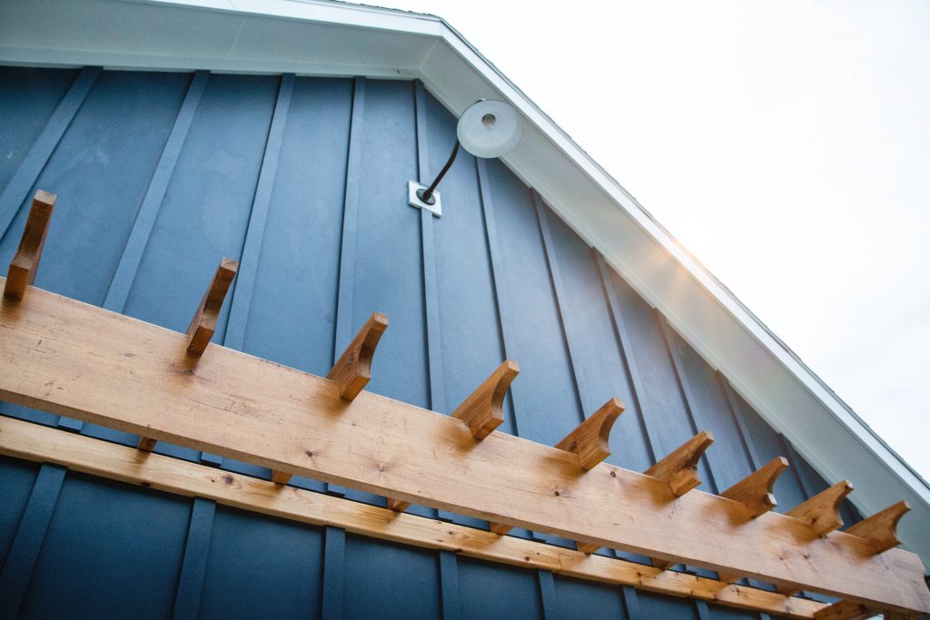 A pergola style eave on a barn-like garage