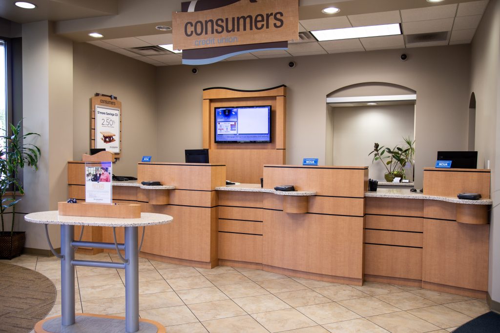 Consumers Credit Union front desk with withdrawal and deposit slip kiosk in the foreground