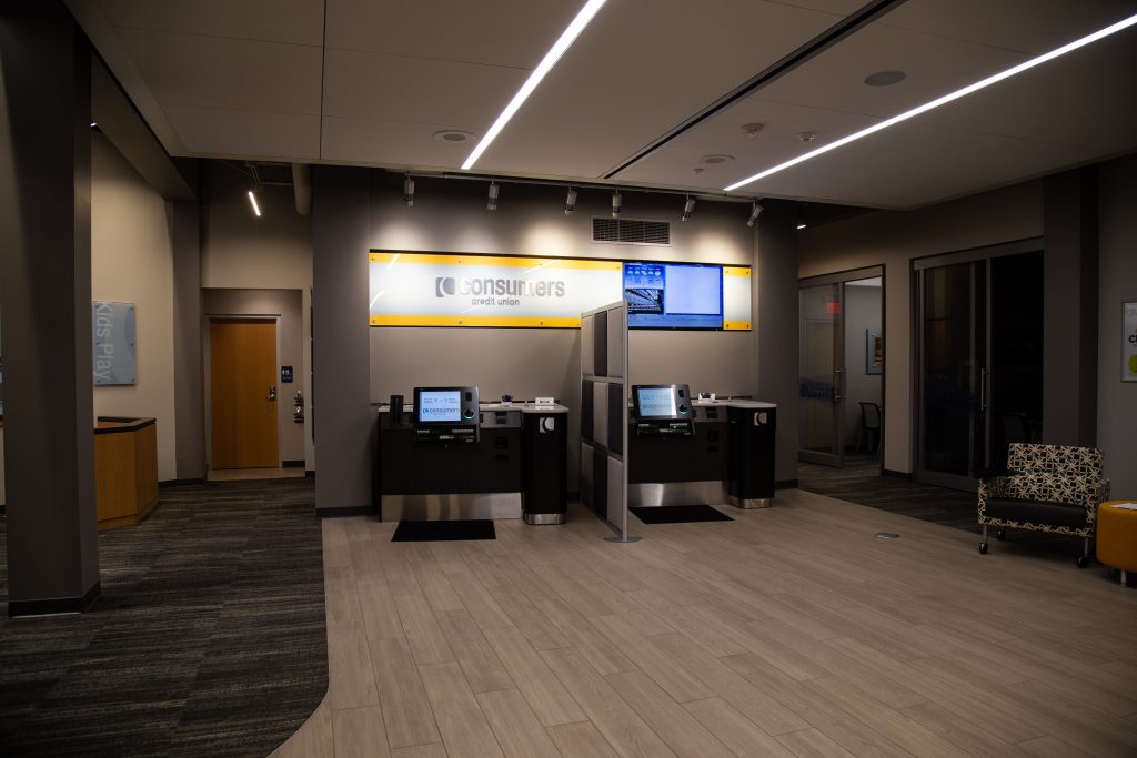 A Consumers Credit Union office lobby with two self-serve banking kiosks