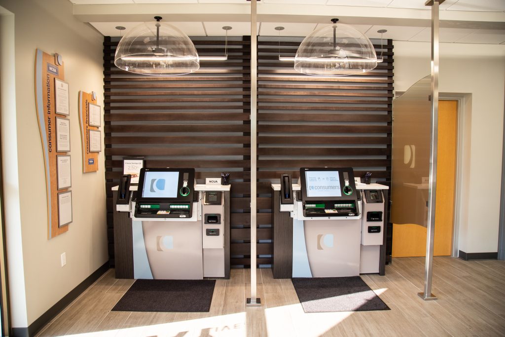 A front view of two self-service tellers in a Consumers Credit Union office