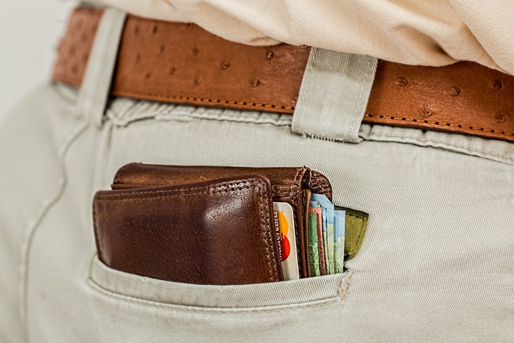 Close-up of a man's wallet sticking out of his back pocket