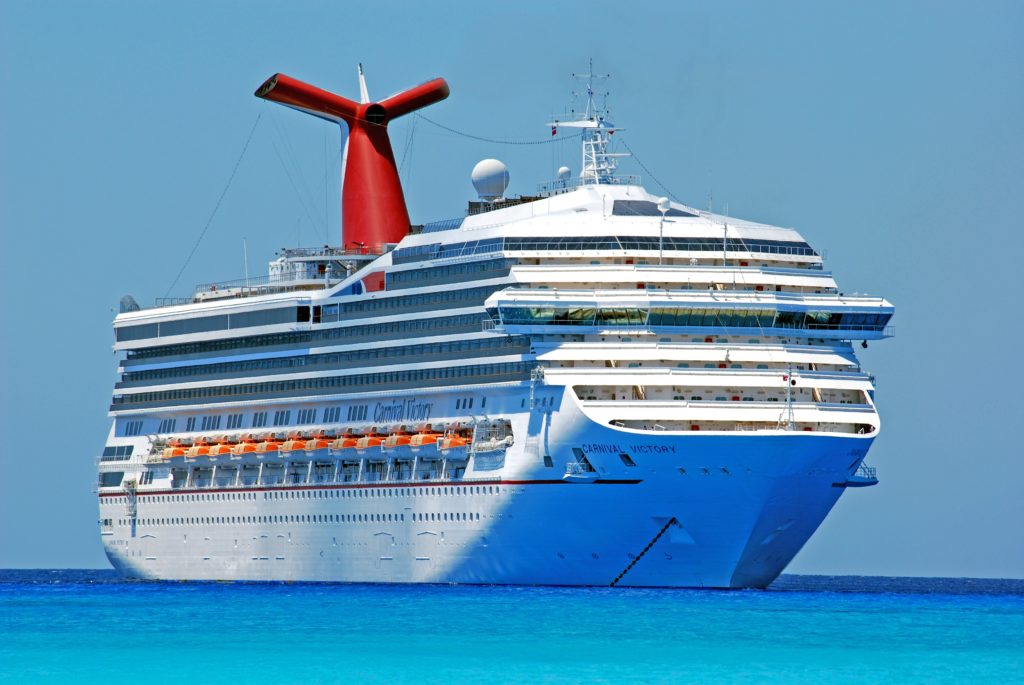 A Carnival Cruise boat in the water on a clear day