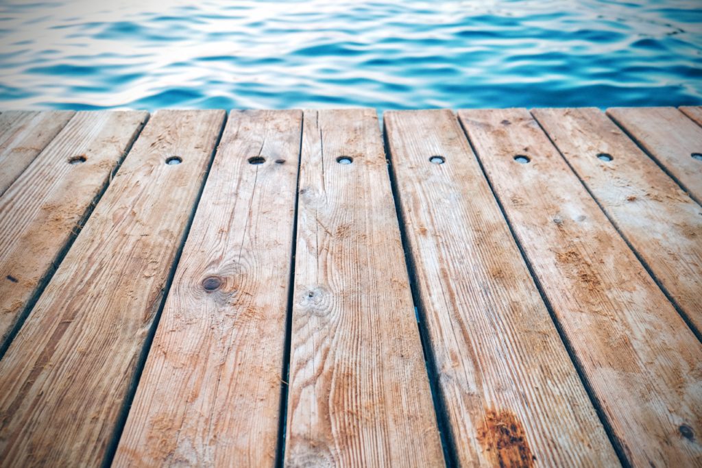 A close-up of a wooden planks on a pier.