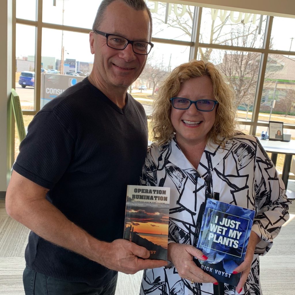 Lynne Jarman-Johnson of Consumers Credit Union with Rick Vuyst, the author of Operation Rumination.