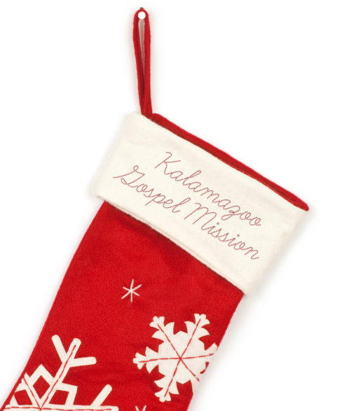 Kalamazoo Gospel Mission red Christmas Stocking with snowflake designs.