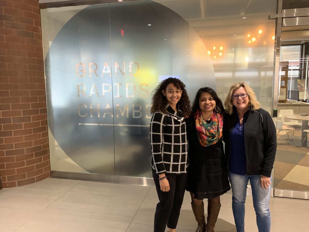 Lynne Jarman Johnson, Consumers Credit Union "Money, I'm home" podcast host with guests outside of the Grand Rapids Chamber of Commerce.