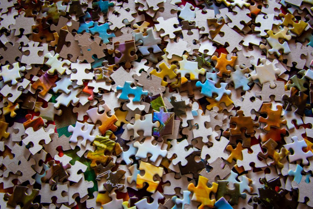 A pile of multicolor jigsaw puzzle pieces.