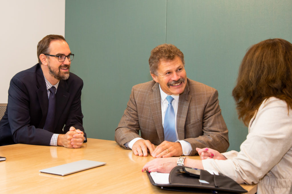 Jeremy Prins and Gary Ferguson of Consumers Credit Union Business Services Department during a meeting.