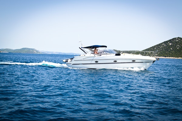White speed boat on the open water