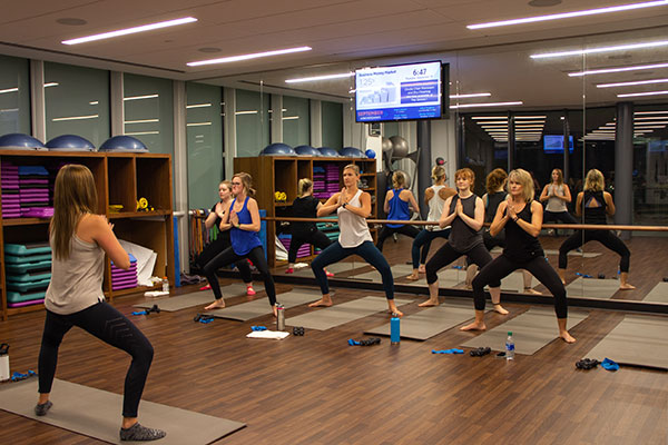 Group of six women in a workout studio