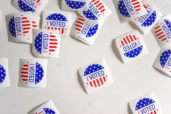 Little, round "I Voted" stickers on a white background