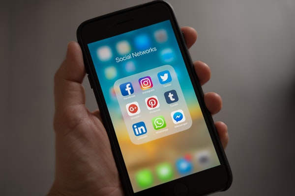Black smart phone showing social media apps
