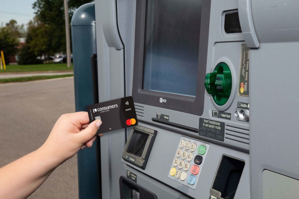 Person inserting their debit card into a TellerPlus+ machine