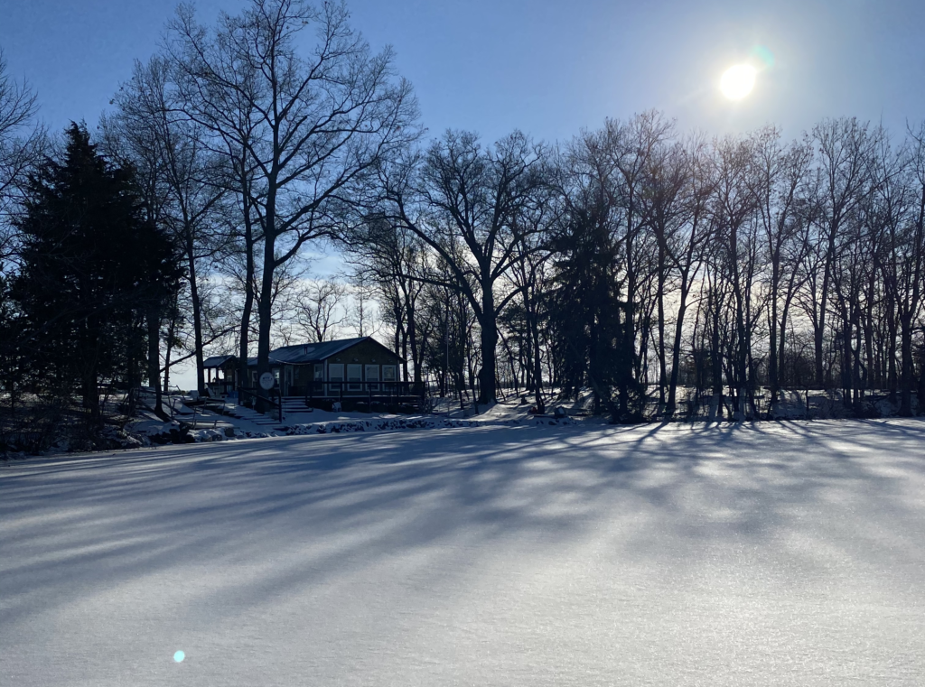 A lake house on Gun Lake in Michigan on a snowy day.