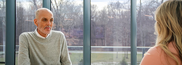 Brett Clark talking to a member