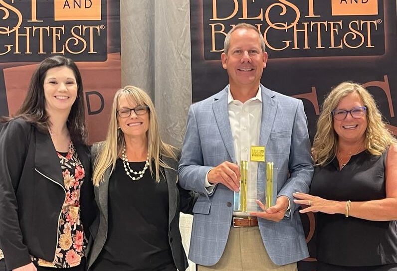 (left to right) Stephanie Stacey, Shawn Premer, Scott Sylvester and Lynne Jarman-Johnson accept the Best and Brightest Award on behalf of Consumers Credit Union.