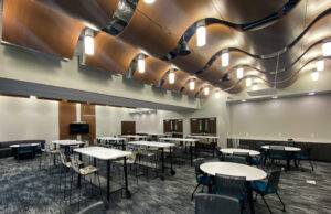 Consumers Credit Union's Cedar office community event space filled with tables and chairs.