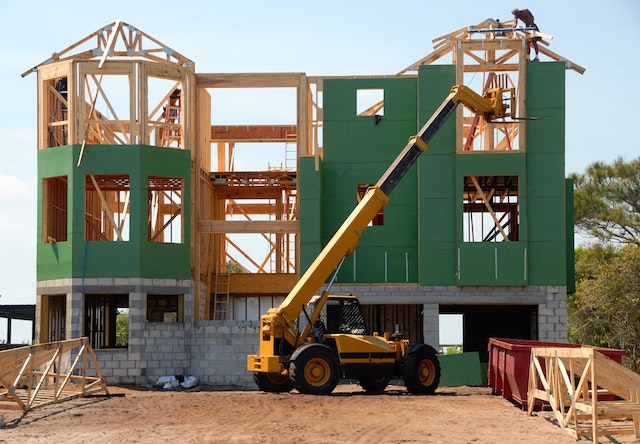 An exterior photo of a house under construction.