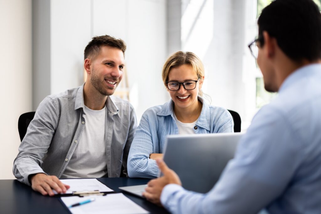 Man and woman meeting with a financial advisor.