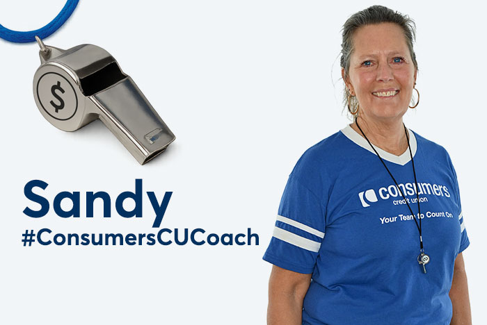 Coach Sandy smiles in front of whistle graphic.