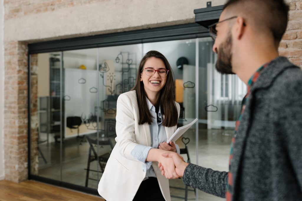 Two people shaking hands after a job interview.