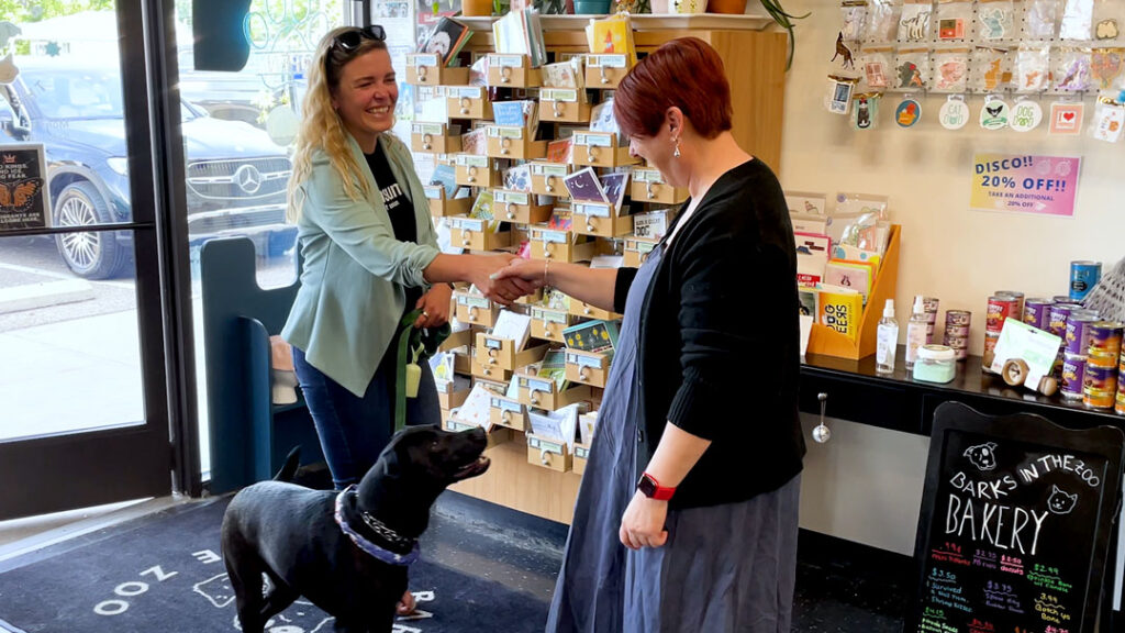 Office manager Adalynn Brouwer shakes hands at a local business.