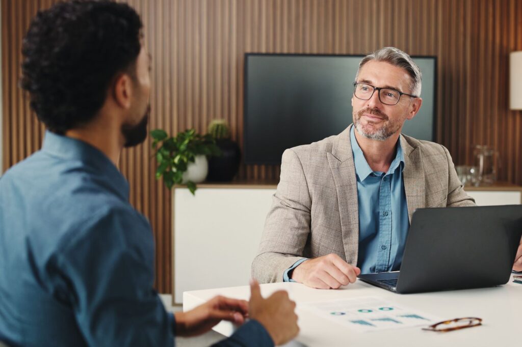 Young man sitting with a financial professional.