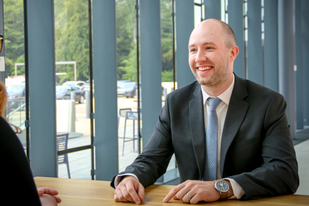 Mortgage Loan Officer Ben Belloli meeting with a member.