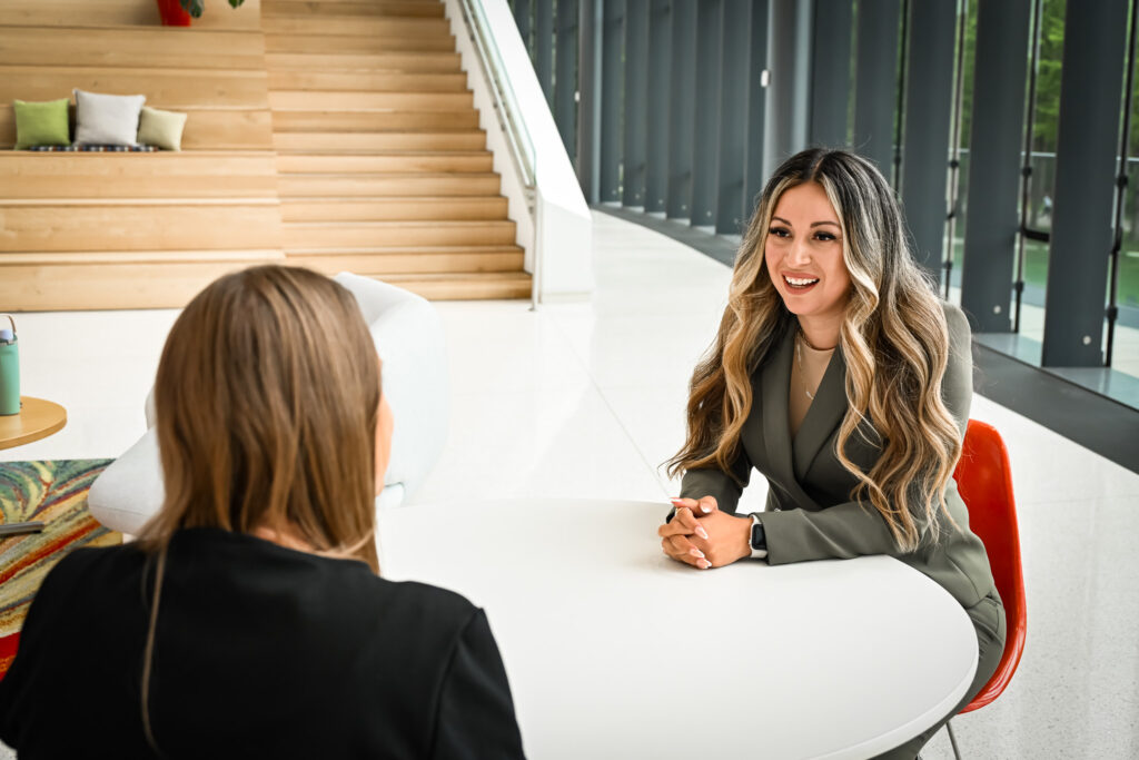 Mortgage Loan Officer Zulema Roa talks with another person