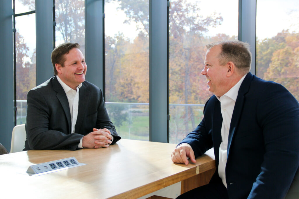 Consumers' Commercial Loan Officers sitting together and laughing.